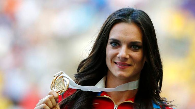 Gold medallist Isinbayeva of Russia holds her medal at the women's pole vault victory ceremony during the IAAF World Athletics Championships in Moscow