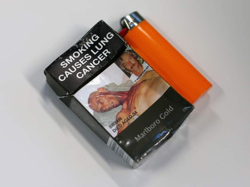 cigarette packaging ireland Irish Health Minister James Reilly holds examples of plain pack cigarettes as Ireland Plain cigarette packaging begins in