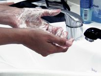 Someone uses a face wash containing microbeads