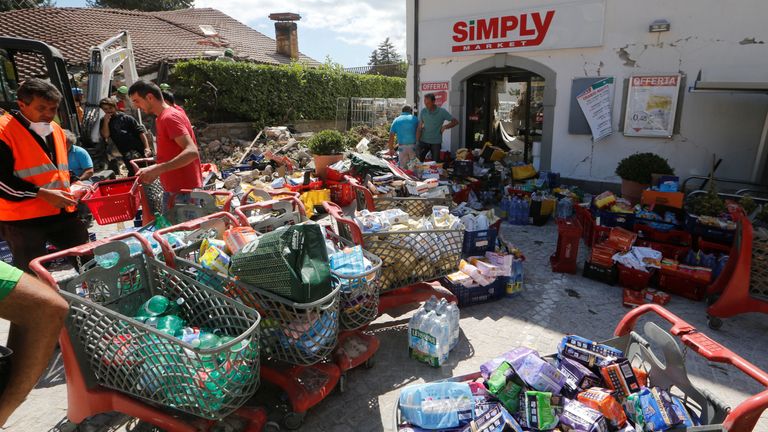 Rescuers gather food and basic necessities for survivors in Amatrice