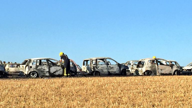 The blaze left behind the charred wrecks of cars