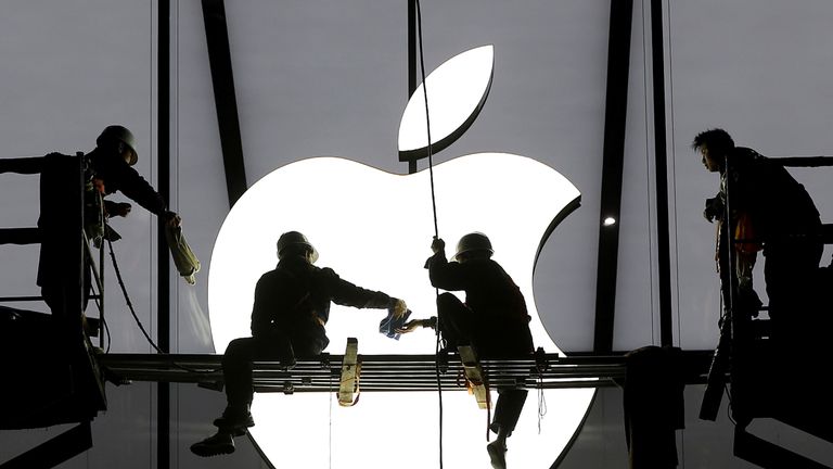 Workers prepare for the opening of an Apple store in Hangzhou, China