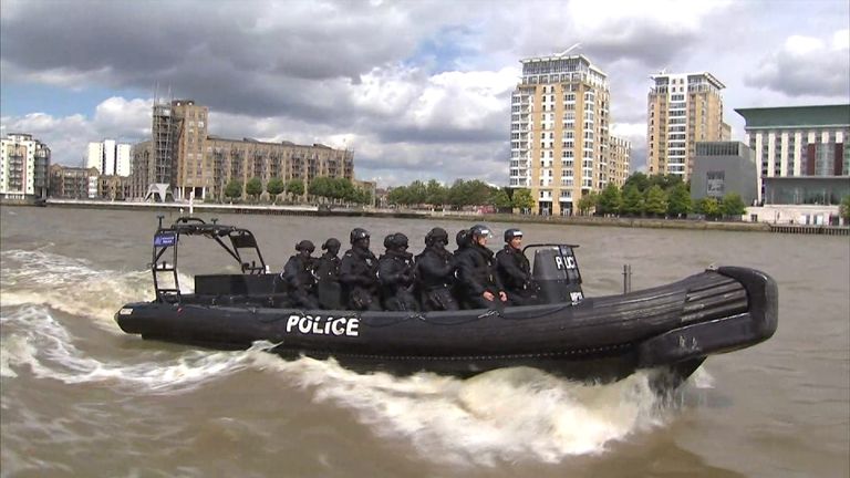 A Metropolitan Police boat containing anti-terrorism officers patrols the River Thames.