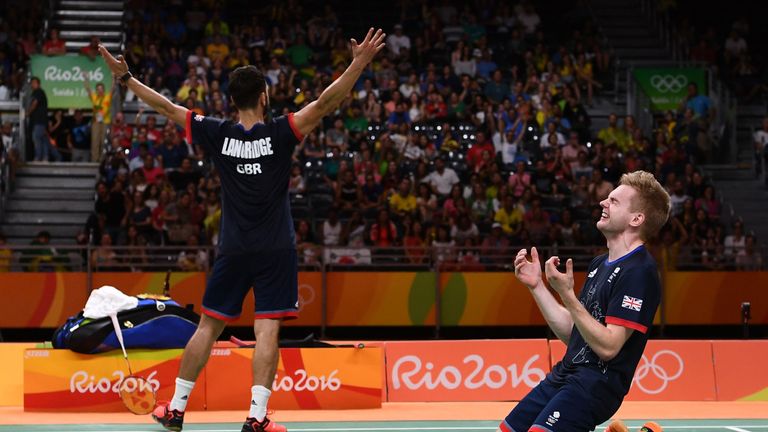 Chris Langridge and Marcus Ellis of Great Britain celebrate after winning badminton bronze