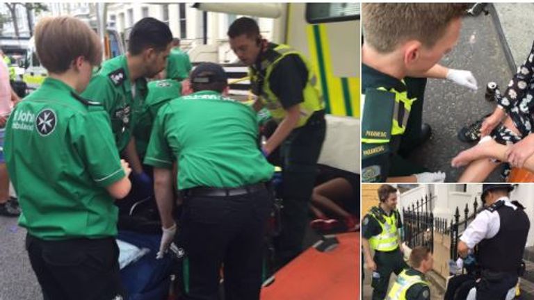 Paramedics treat some of the injured at the Notting Hill Carnival event 