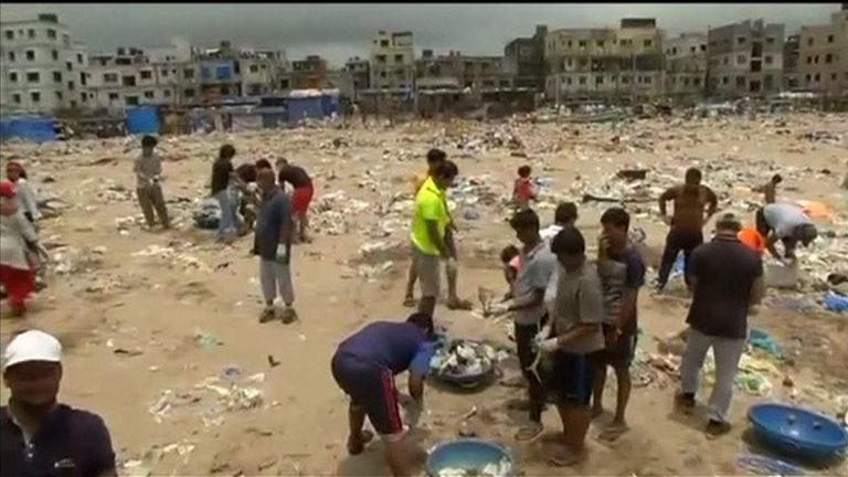 Volunteers help clear mountains of rubbish on Mumbai beach