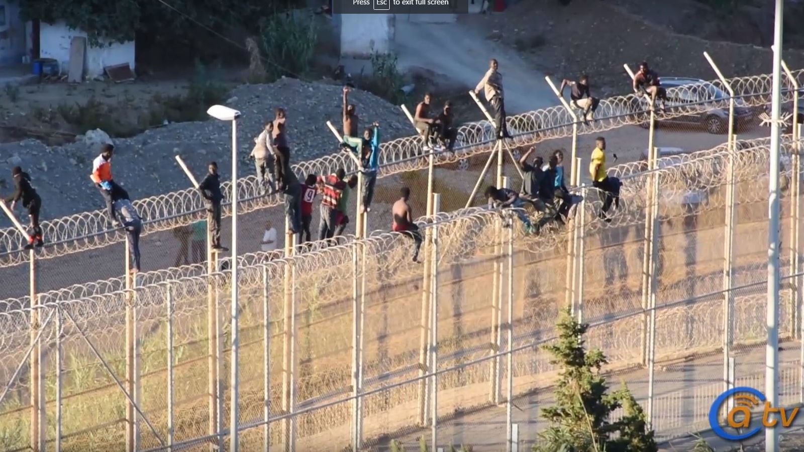 Dozens of migrants trapped for hours on Spanish border fence World News Sky News