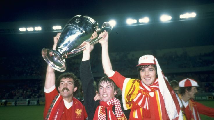 Graeme Souness (L), Kenny Dalglish (C) and Alan Hansen (R) hold up the European Cup after beating Real Madrid in the 1981 European Cup final. 