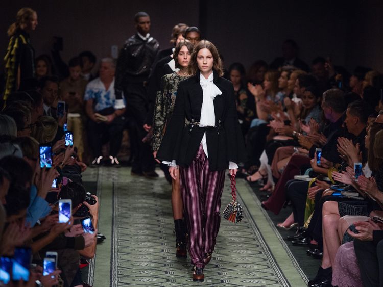 Models walk the runway at the Burberry show