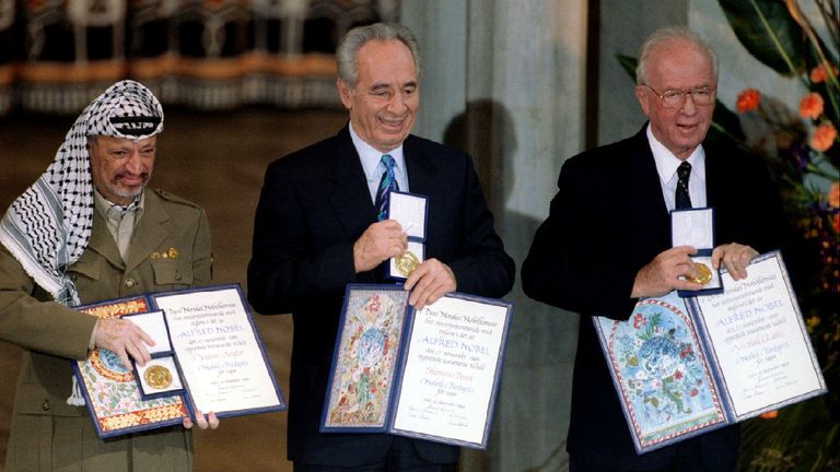 Shimon Peres (centre) receives his Nobel Peace Prize with Yasser Arafat (left) and Yitzhak Rabin (right)
