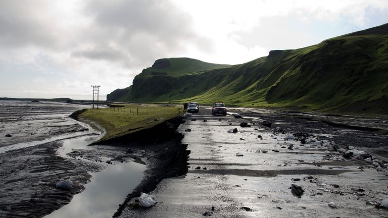 A road damaged by floodwater from a glacier which lies over the Katla volcano