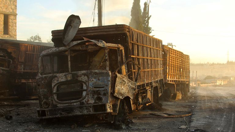 Damaged aid trucks after an airstrike on the rebel held Urm al-Kubra town, western Aleppo city, Syria