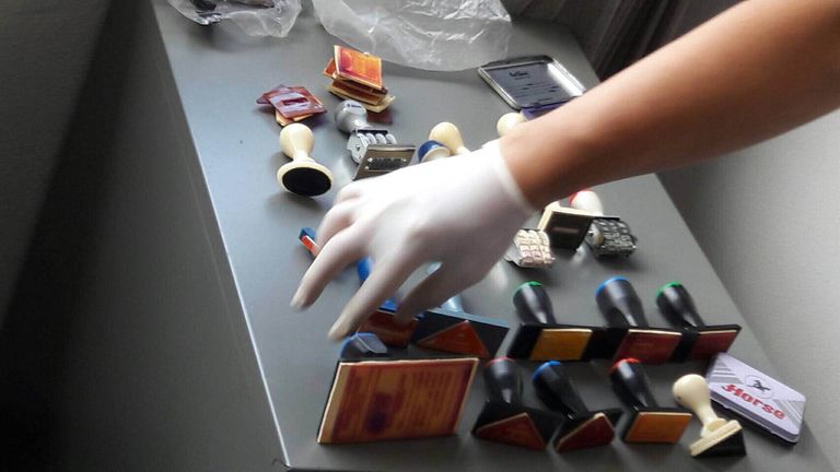 Stamps found at a suspected passport forgery factory in Bangkok (Tom Rayner story)