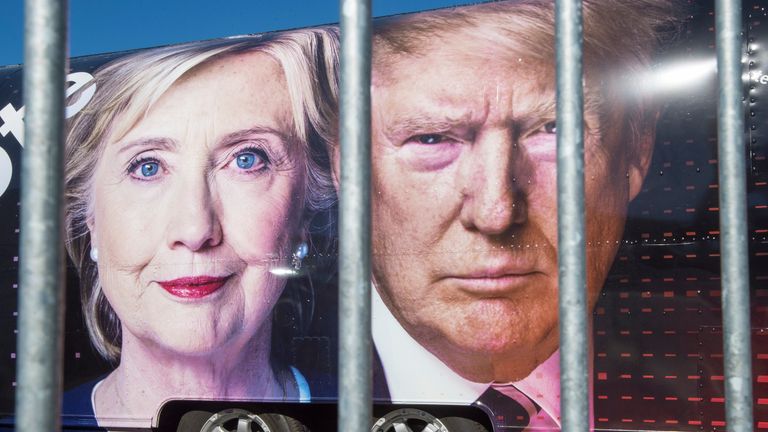 Pictures of Hillary Clinton and Donald Trump on the side of a campaign bus