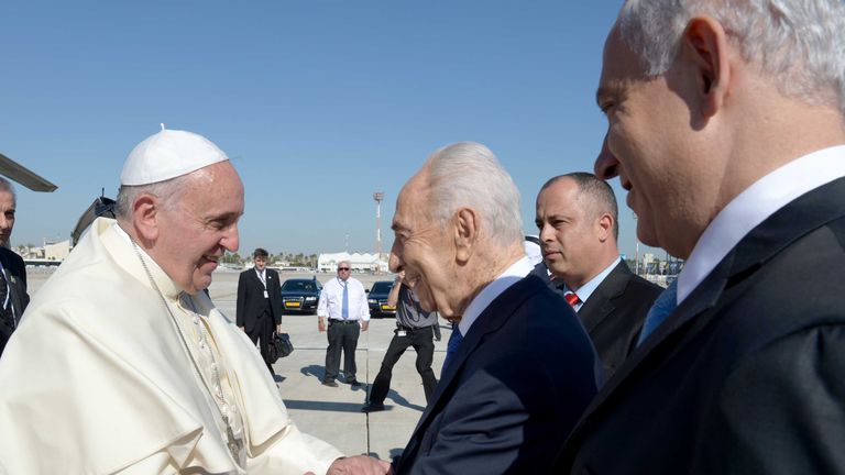 Pope Francis is greeted by Israel President Shimon Peres and Prime Minister of Israel Benjamin Netanyahu during a welcoming cermony at Ben Gurion Airport  on May 25, 2014, in Tel Aviv