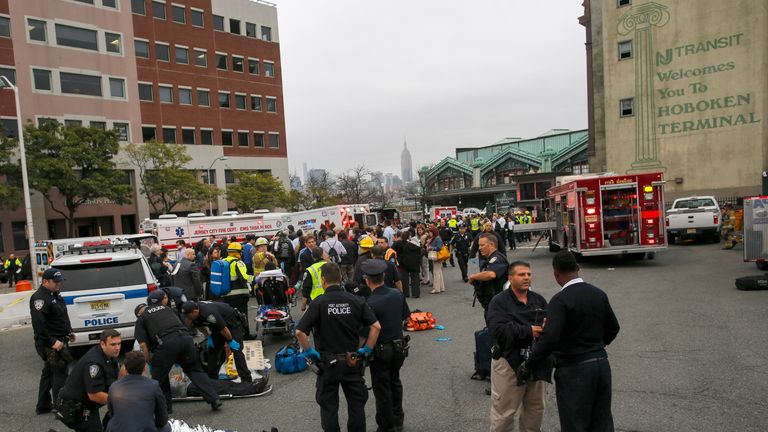First responders treat injured passengers after the train crashed into the platform at Hoboken Terminal during morning rush hour 