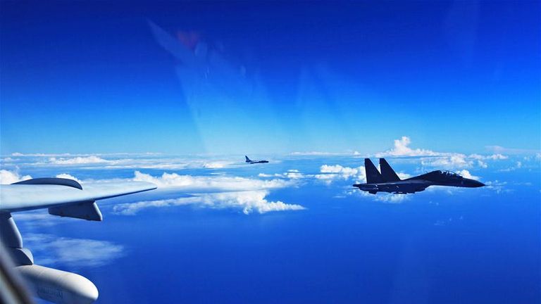 A Su-30 fighter and an H-6K bomber of the Chinese Air Force take part in a drill, Sept. 25, 2016. The Chinese Air Force on Sunday sent more than 40 aircraft of various types to the West Pacific, via the Miyako Strait, for a routine drill on the high seas, a spokesperson said. Bombers and fighters of the PLA Air Force also conducted routine patrol in the East China Sea Air Defense Identification Zone (ADIZ). (Xinhua/Tian Ning)