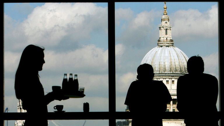 Visitors admire St Paul&#39;s Cathedral from the restaurant of the Tate Modern March 2007