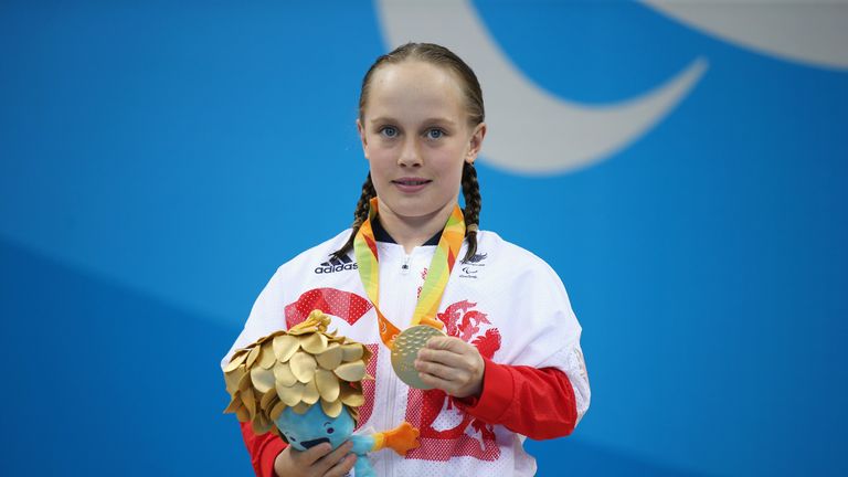 Gold medalist Ellie Robinson of Great Britain celebrates on the podium at the medal ceremony for the Women&#39;s 50m Butterfly - S6 on day 2 of the Rio 2016 Paralympic Games at the Olympic Aquatics Stadium on September 9, 2016 in Rio de Janeiro, Brazil