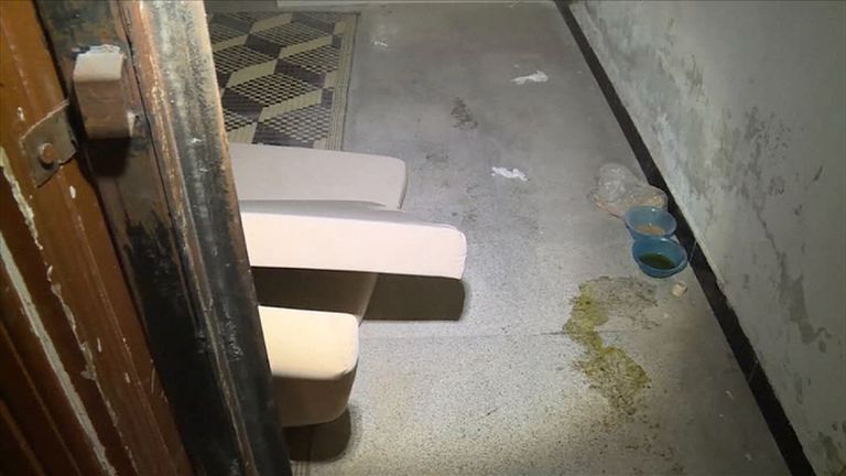 Bowls and liquid on the floor in an apparent prison allegedly used by Islamic State group (IS) militants to imprison and torture women, according to news agency Arab24. 