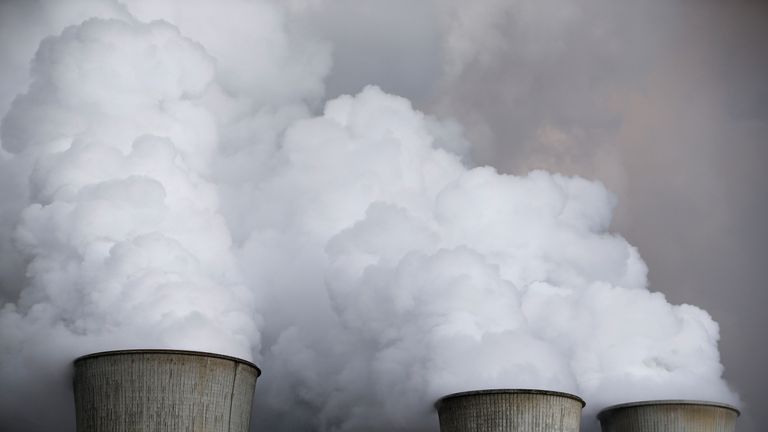 Steam rises from the cooling towers of the RWE coal power plant in Niederaussem, Germany