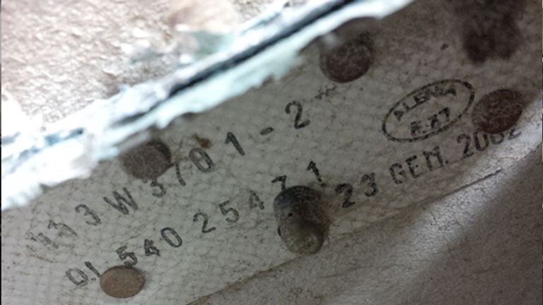 Part number and date stamp on outboard flap of missing Malaysia Airlines jet MH370 found in Tanzania. Pic: Australia Transport Safety Bureau 