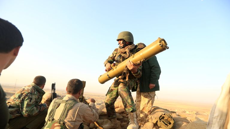 Peshmerga forces prepare their anti-tank guided missiles in front of Islamic state militants' positions