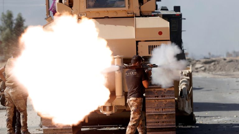 An Iraqi special forces soldier fires an RPG during clashes with Islamic States fighters in Bartella