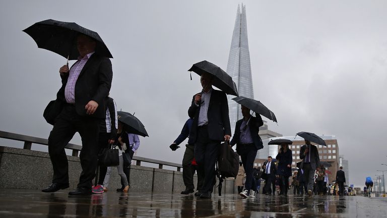 Commuters headinto the City of London across London Bridge