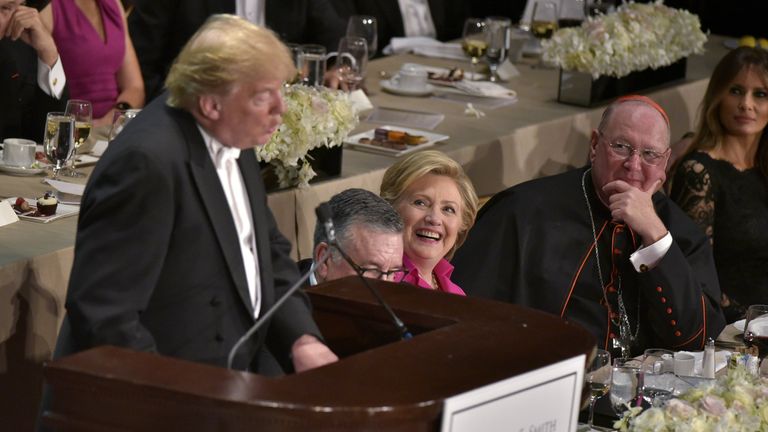 Democratic presidential nominee Hillary Clinton laughs as Republican presidential nominee Donald Trump speaks during the 71st annual Alfred E. Smith Memorial Foundation Dinner 