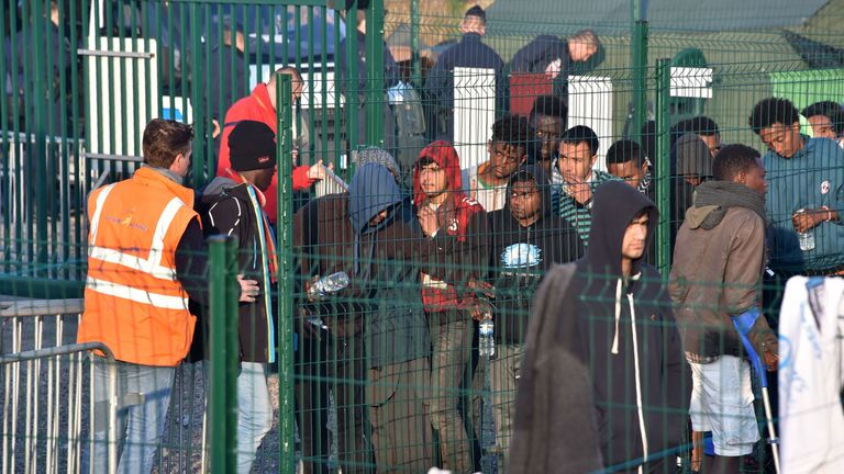 Minors are the priority as migrants are processed to clear the camp