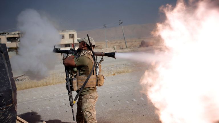 An Iraqi special forces soldier fires a RPG during clashes with Islamic States fighters in Bartella