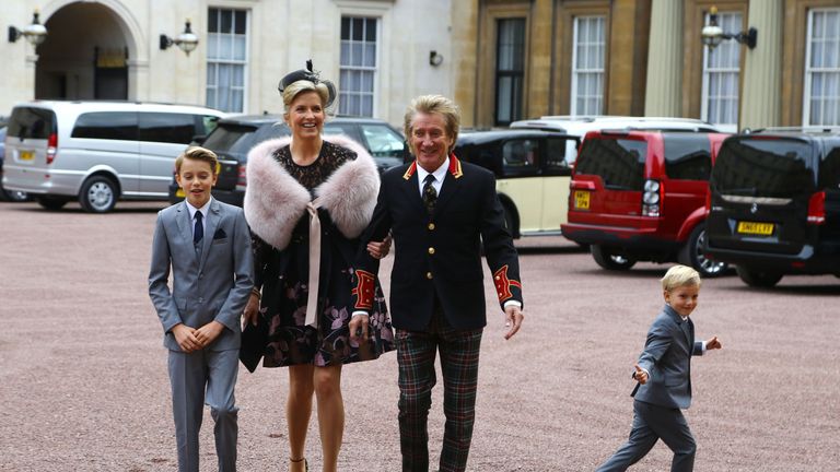 Veteran singer Sir Rod Stewart arriving at Buckingham Palace in London, with his wife, Penny Lancaster and children Alastair and Aiden, ahead of him receiving his knighthood in recognition of his services to music and charity