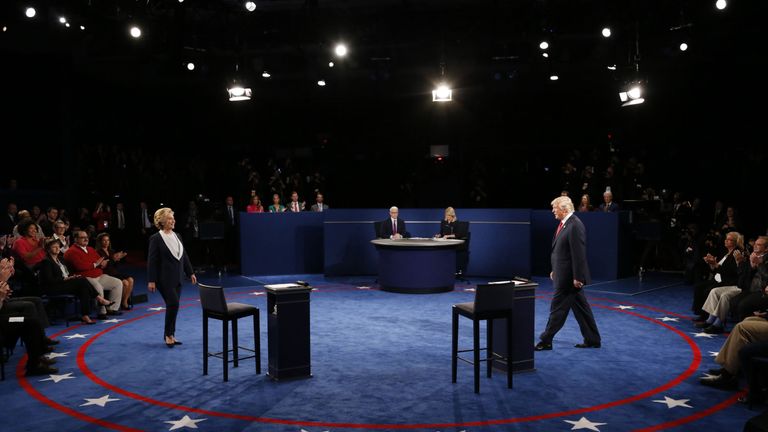 Donald Trump and Hillary Clinton take the stage at the start of their presidential town hall debate