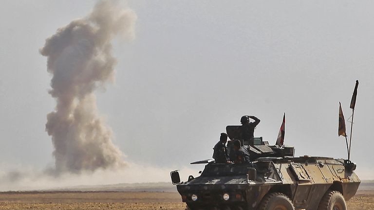 Iraqi forces battle against Islamic State (IS) group jihadists in the Bajwaniyah village