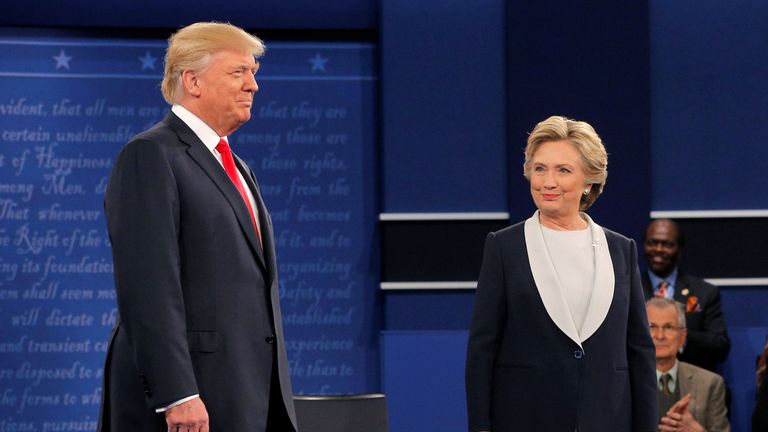 Donald Trump and Hillary Clinton take the stage at the start of their presidential town hall debate