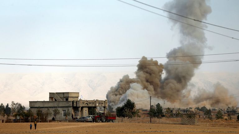 Smoke rises from a bomb attack south of Mosul, during an operation to attack Islamic State militants