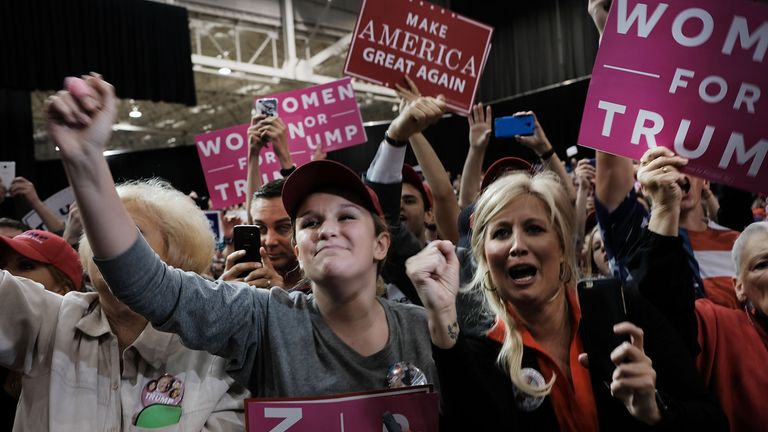 Woman supporters cheer Donald Trump as he speaks at a rally in Cleveland, Ohio
