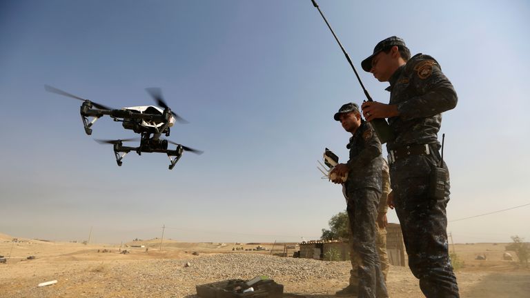 A member of Iraqi forces operates an unmanned drone to make it fly over Islamic State position outside the town of Safayah near Mosul