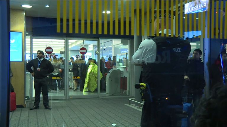 Passengers and security at London City Airport following the evacuation