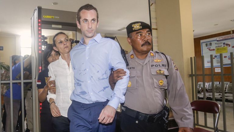 David Taylor and Australian woman Sara Connor are escorted by police 