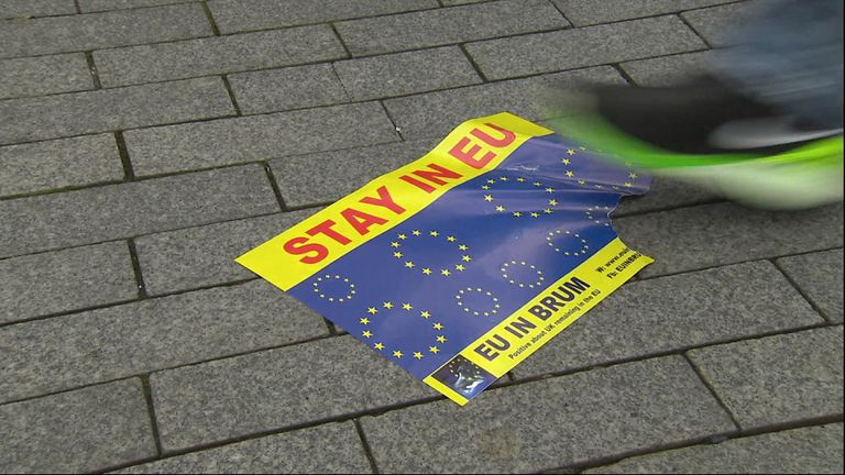 Remain poster in tatters