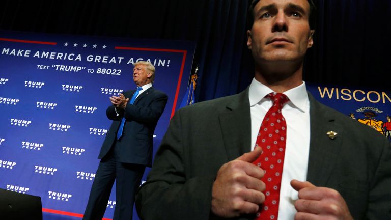 A Secret Service agent watches from the edge of the stage as Republican presidential nominee Donald Trump holds a campaign rally in Green Bay, Wisconsin, U.S. October 17, 2016. REUTERS/Jonathan Ernst