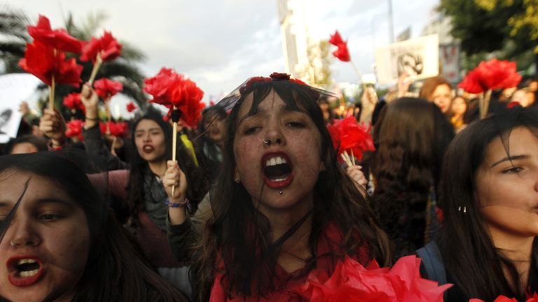 Women takes part in a march in Santiago, Chile