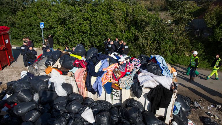 A pile of migrants&#39; belongings is pictured as French demolition teams dismantle the notorious &#39;Jungle&#39; camp by hand before authorities demolish the site on October 25, 2016 in Calais, France. 