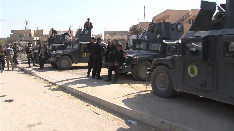 Government troops in the Iraqi town of Bartella after it was liberated from IS
