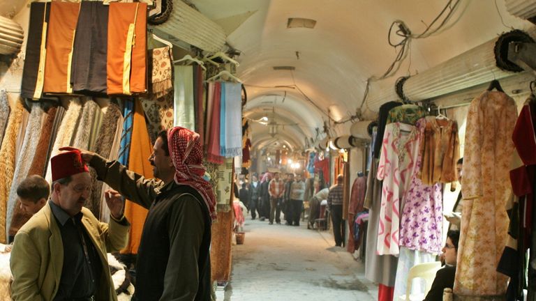 Vendors talk inside one of Aleppo's 37 old souks in Syria March 7, 2006. 