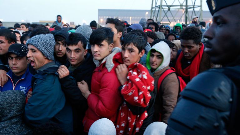 Migrants who claim to be minors wait for their registration and evacuation from the camp