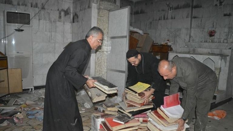 People clean up a Christian church in Bartella, near Mosul, which has been retaken from Islamic State. Pic: A Demand For Action