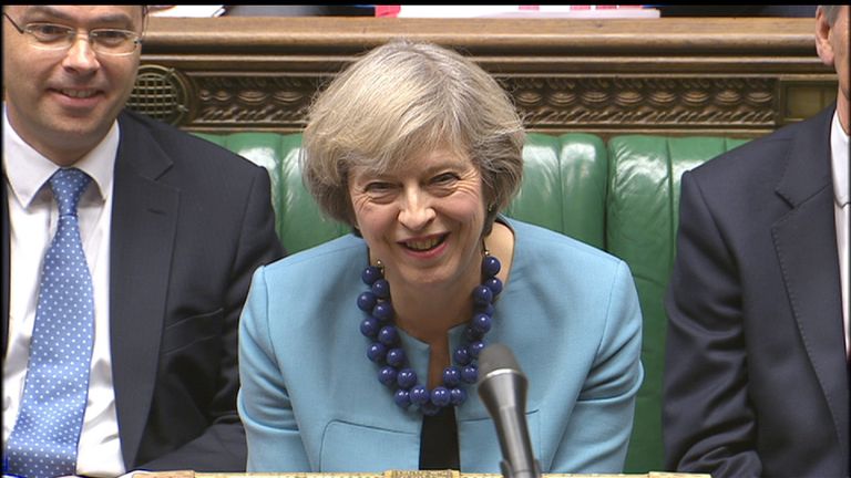 Theresa May enjoys a joke during PMQs